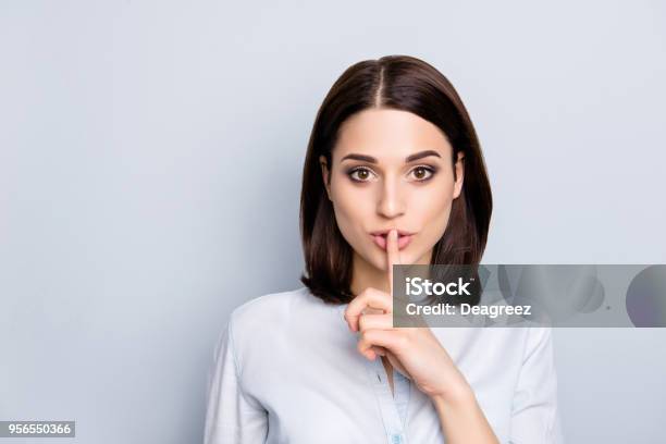 Shh Shy Sly People Person Modern Concept Close Up Portrait Of Cute Lovely Attractive Uncertain Unsure With Stylish Hairdo Entrepreneur Making Hush Gesture Isolated On Gray Background Copyspace Stock Photo - Download Image Now