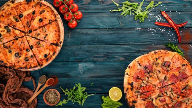 istock Set pizza. Italian cuisine. Top view. On a wooden background. Copy space. 956553994