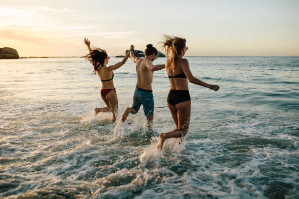 istock Friends having fun at the beach 956554924