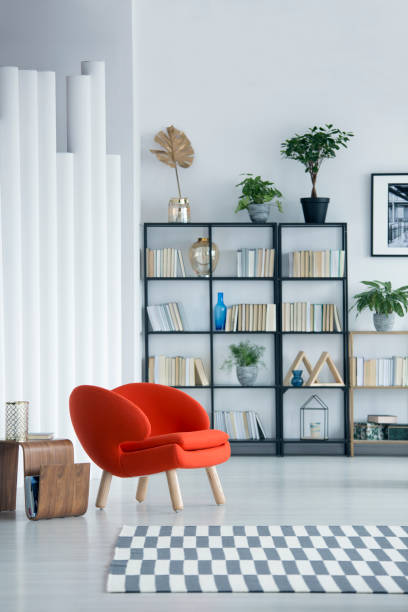 istock Orange armchair in reading room 956563942