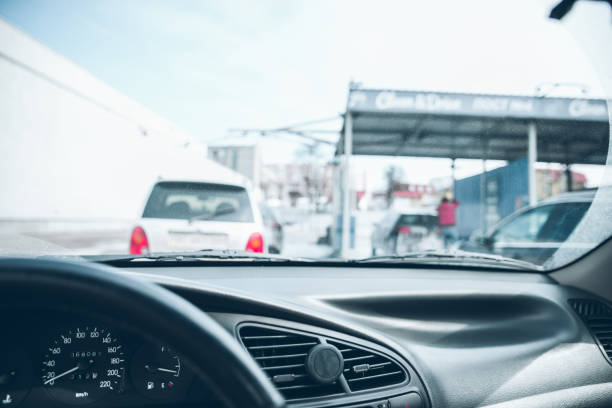 istock car line in car wash. time to clean auto. view from inside 956564418