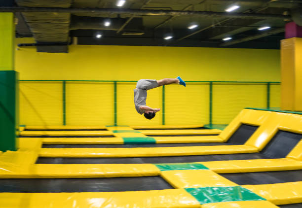 istock trampoline jumper performs acrobatic exercises on the trampoline 956565844