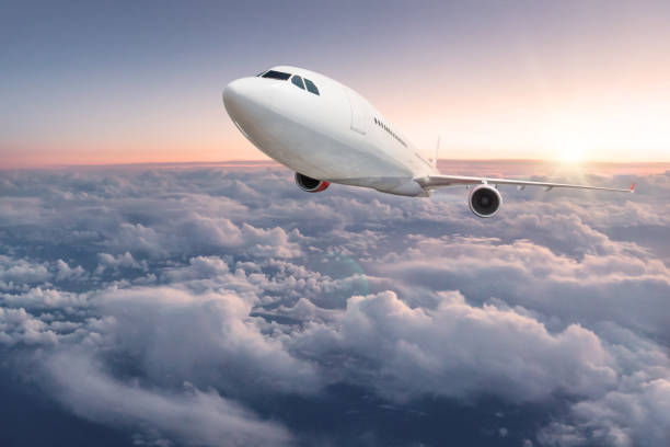istock Commercial airplane flying above clouds 956568648
