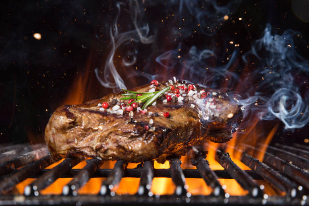 istock Beef steak on the grill with flames 956569260