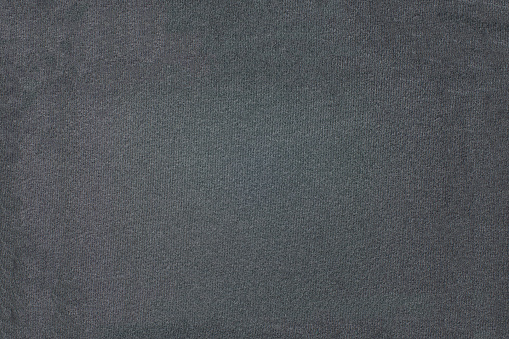 Black background texture of black cloth closeup.