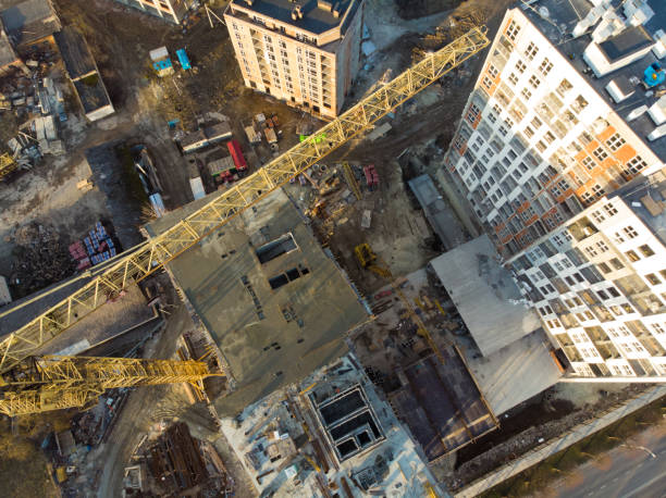 istock birds eye view on contraction site with crane 956571502