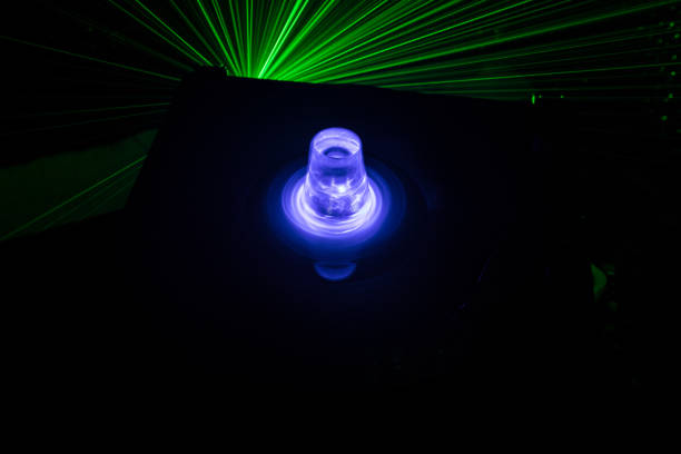 istock Turntable playing vinyl with glowing abstract lines concept on dark background 956587730