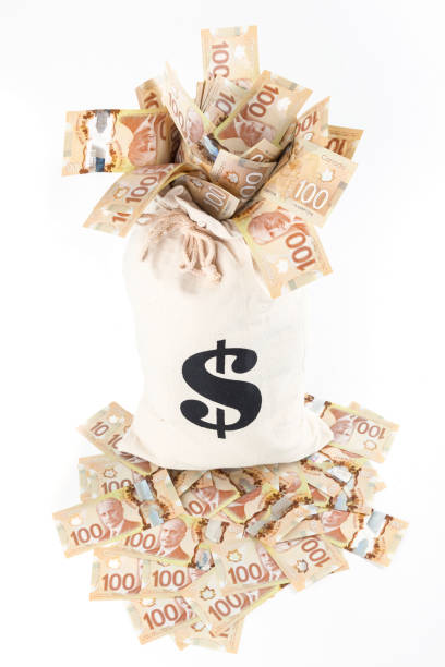 istock Bag Overflowing with Money - Canada 956590908