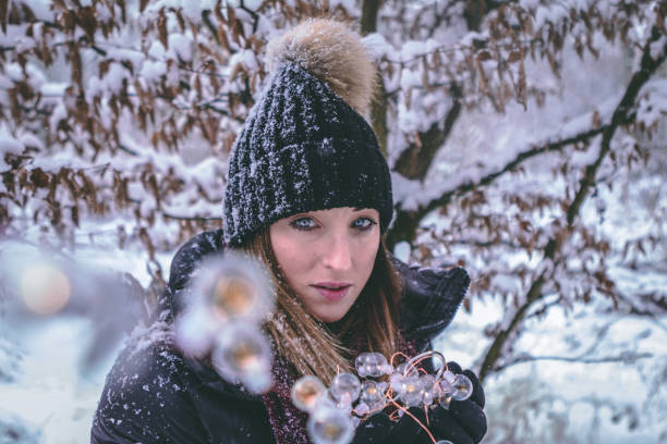 istock Young Girl in Snowy Woods 956593158
