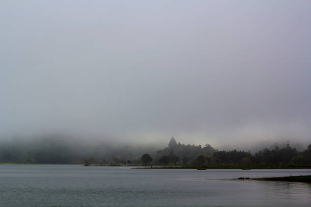 istock Foggy lake landscape 956596606