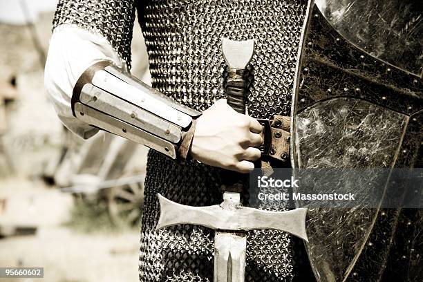 Man In Suit Of Armor With Medieval Sword Stock Photo - Download Image Now - Knight - Person, Medieval, Traditional Armor