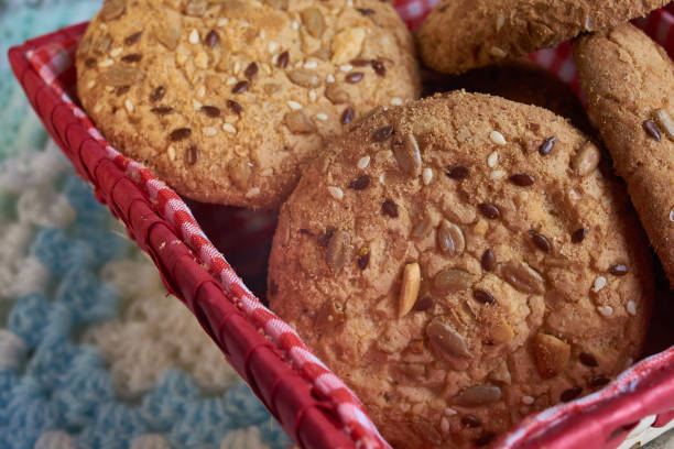 istock Savory cookies sprinkled with sesame seeds, sunflower on textile plaid 956609074