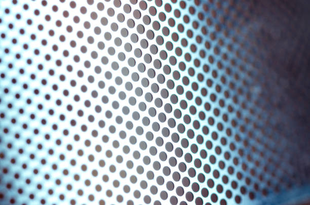 istock Shiny metal sheet with holes 956619116