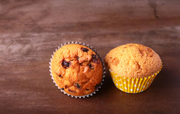 istock Tasty chocolate cupcakes, muffins on a white wooden table 956622160