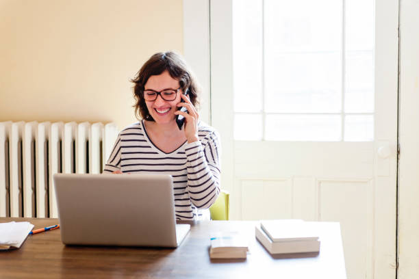 istock Woman working from home in her appartement. 956628046