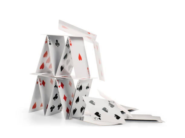 falling house of cards isolated with clipping path - caindo imagens e fotografias de stock