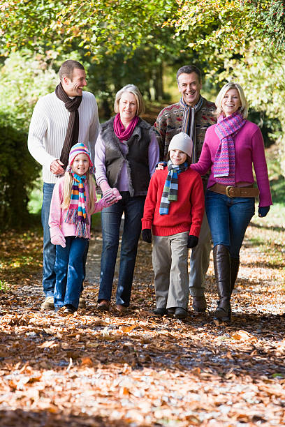 istock Multi-generation family on walk through autumn woods 95664308