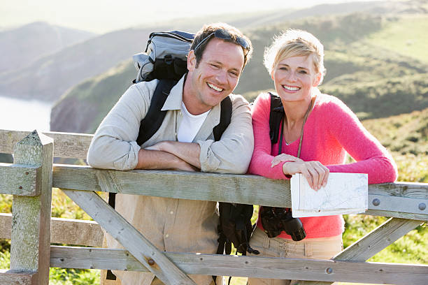 istock Couple on cliffside outdoors 95664393