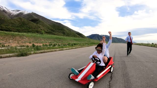 Young Business Team of Children Go Cart Race