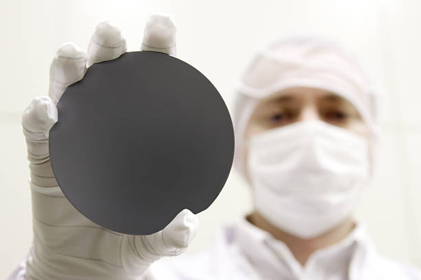 A scientist holding up a black circle to the camera stock photo