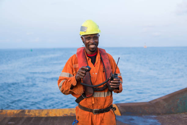 istock Seaman AB or Bosun on deck of vessel or ship , wearing PPE 956658032