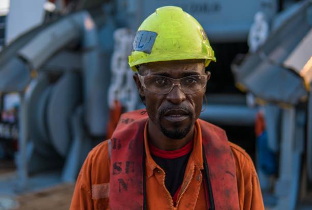 istock Seaman AB or Bosun on deck of vessel or ship , wearing PPE 956658048