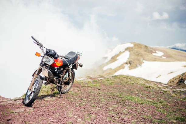 istock motorbike on mountain 956661118