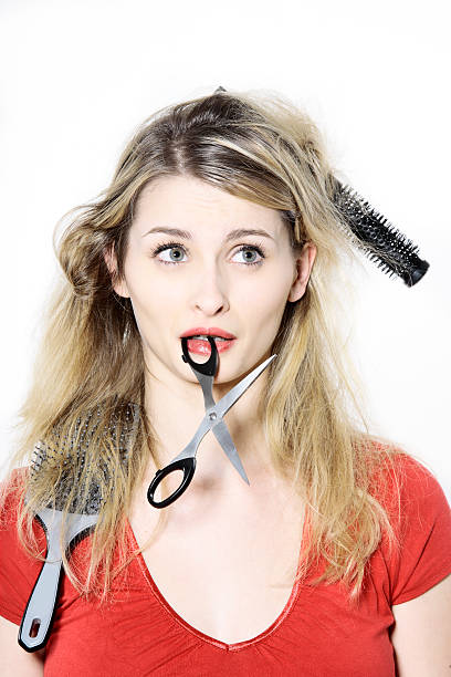 Young woman getting a haircut at the hairdresser