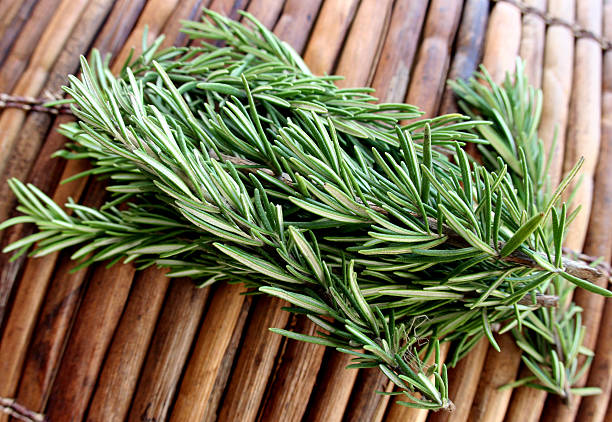 Thyme sprigs on a bamboo mat stock photo