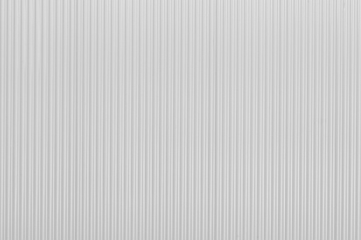 Corrugated new white zinc metal wall of fence as textured and background