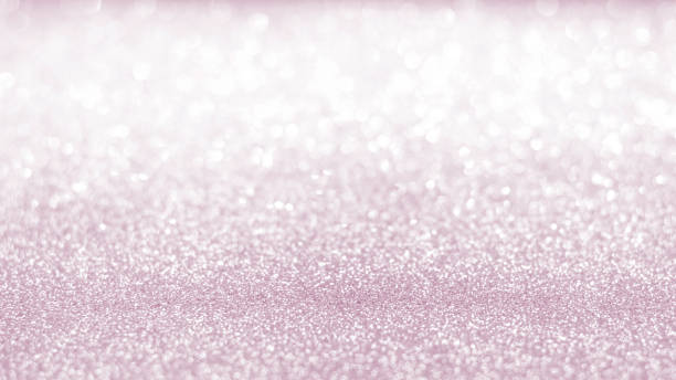istock Rose gold pink blur glitter bokeh background with blurry silver white sparkling light of metallic texture shimmering backdrop for holiday decoration 956676760