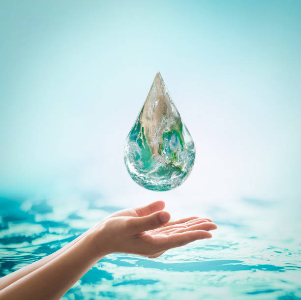 istock World ocean day,, saving water campaign, sustainable ecological ecosystems concept with green earth on woman's hands on blue sea background 956676796