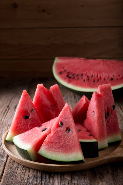 Watermelon on wooden table background stock photo