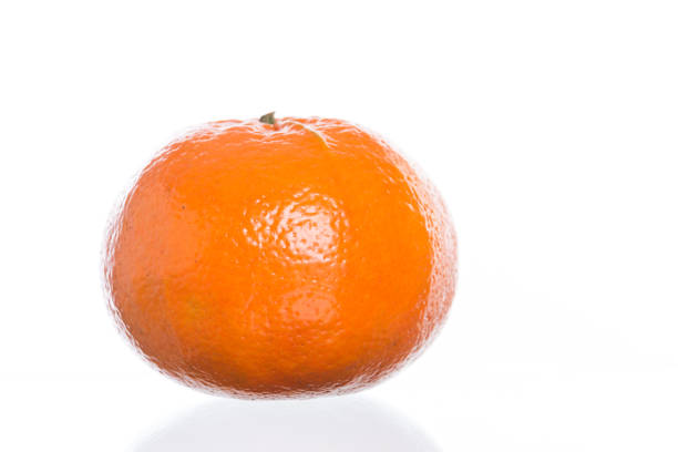 Fresh mandarin orange slices on a wooden table