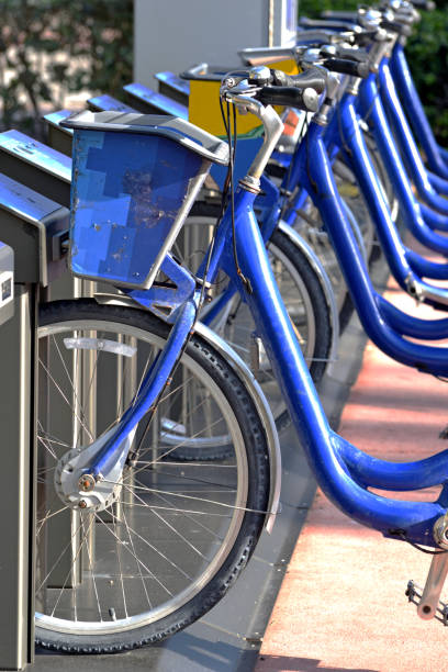 istock Blue Bicycles at Rental Depot Abstract 956693702