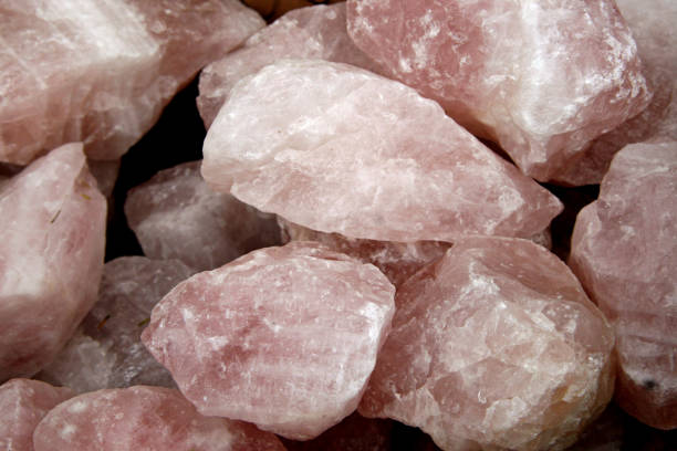 istock raw white rocks pink tint rose quartz 956709678