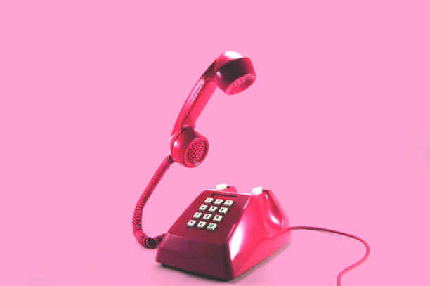 Retro pink telephone Retro pink telephone on pink background, Pop art style ringer stock pictures, royalty-free photos & images