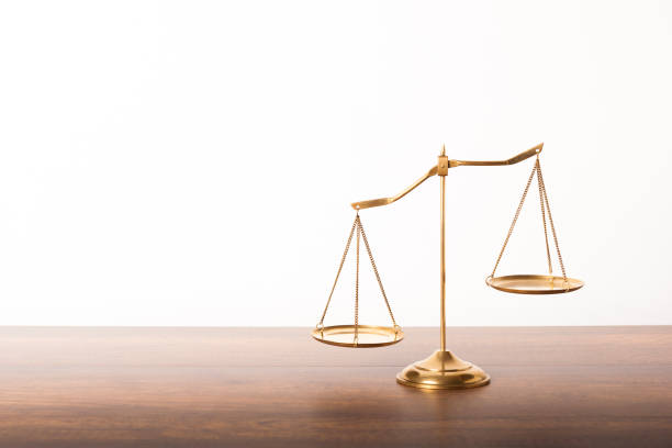 Balance scales Balance scales on table with white wall background. Symbol of justice equal arm balance photos stock pictures, royalty-free photos & images