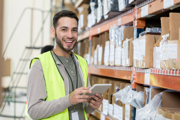 istock Warehouse employee checks warehouse inventory 956728302