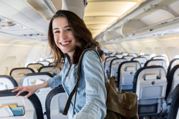 istock Cheerful traveler on airplane 956729440