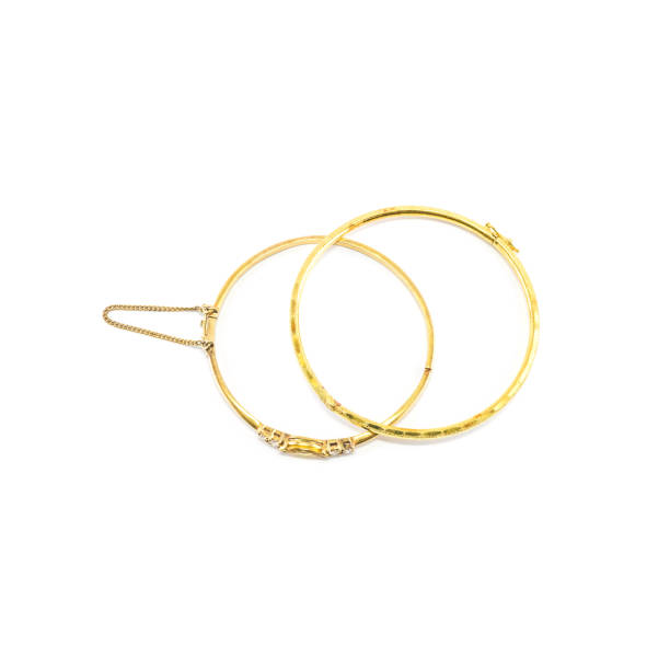 istock gold bracelets isolated on white background 956729478