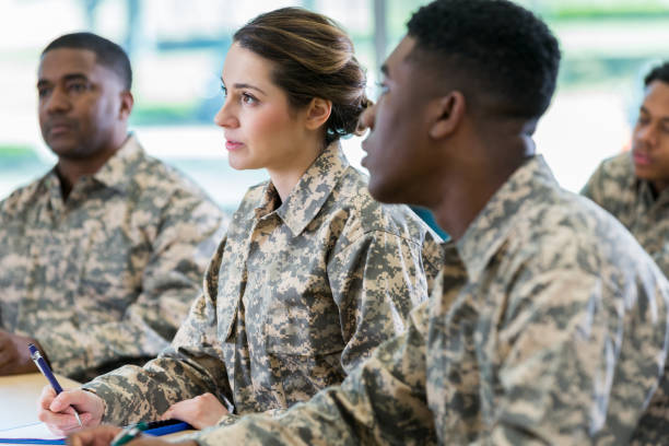 istock Attentive soldiers in college class 956729730