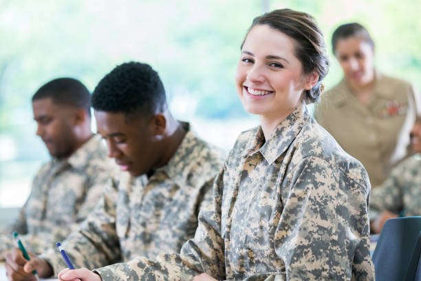 istock Pretty female soldier in college class 956729736