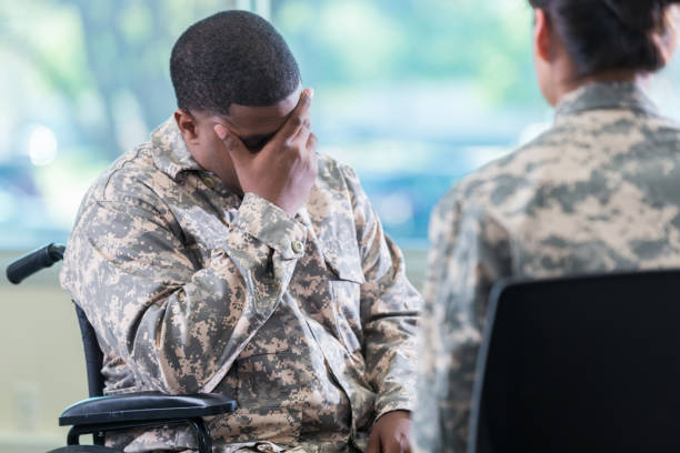 istock Upset injured soldier in therapy session 956729784