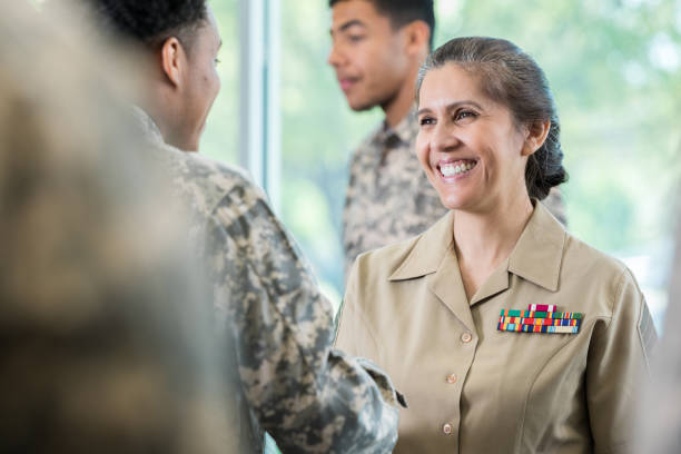 istock Army officer greets new recruit 956729806