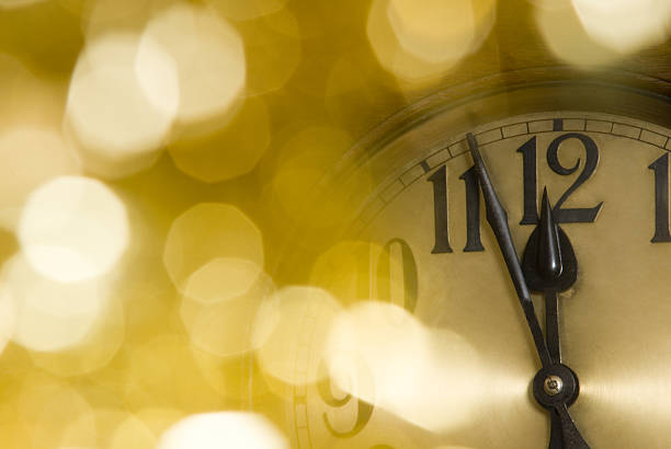 istock Blurred background lights with clock reading 11:57 in focus 95674232
