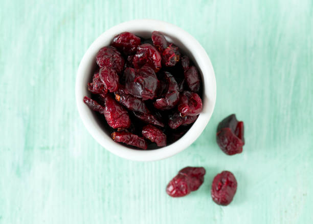 istock cranberry on wooden surface 956742370