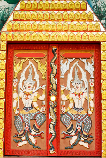 Thai sculpture. Thai sculpture on the door at Wat Boonnark in Thailand. fairy door fairy tale antique stock pictures, royalty-free photos & images
