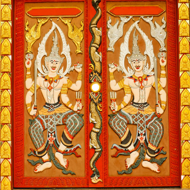 Thai sculpture. Thai sculpture on the door of Wat Boonnark in Thailand. fairy door fairy tale antique stock pictures, royalty-free photos & images