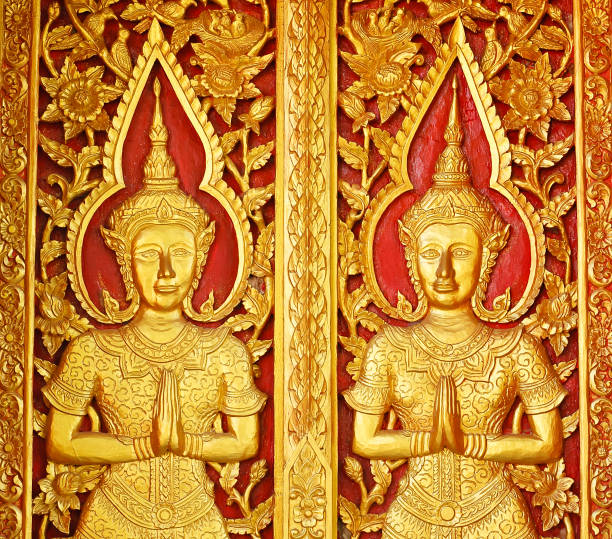 Thai sculpture. Thai sculpture on the door at Wat Boonnark  in Thailand. fairy door fairy tale antique stock pictures, royalty-free photos & images